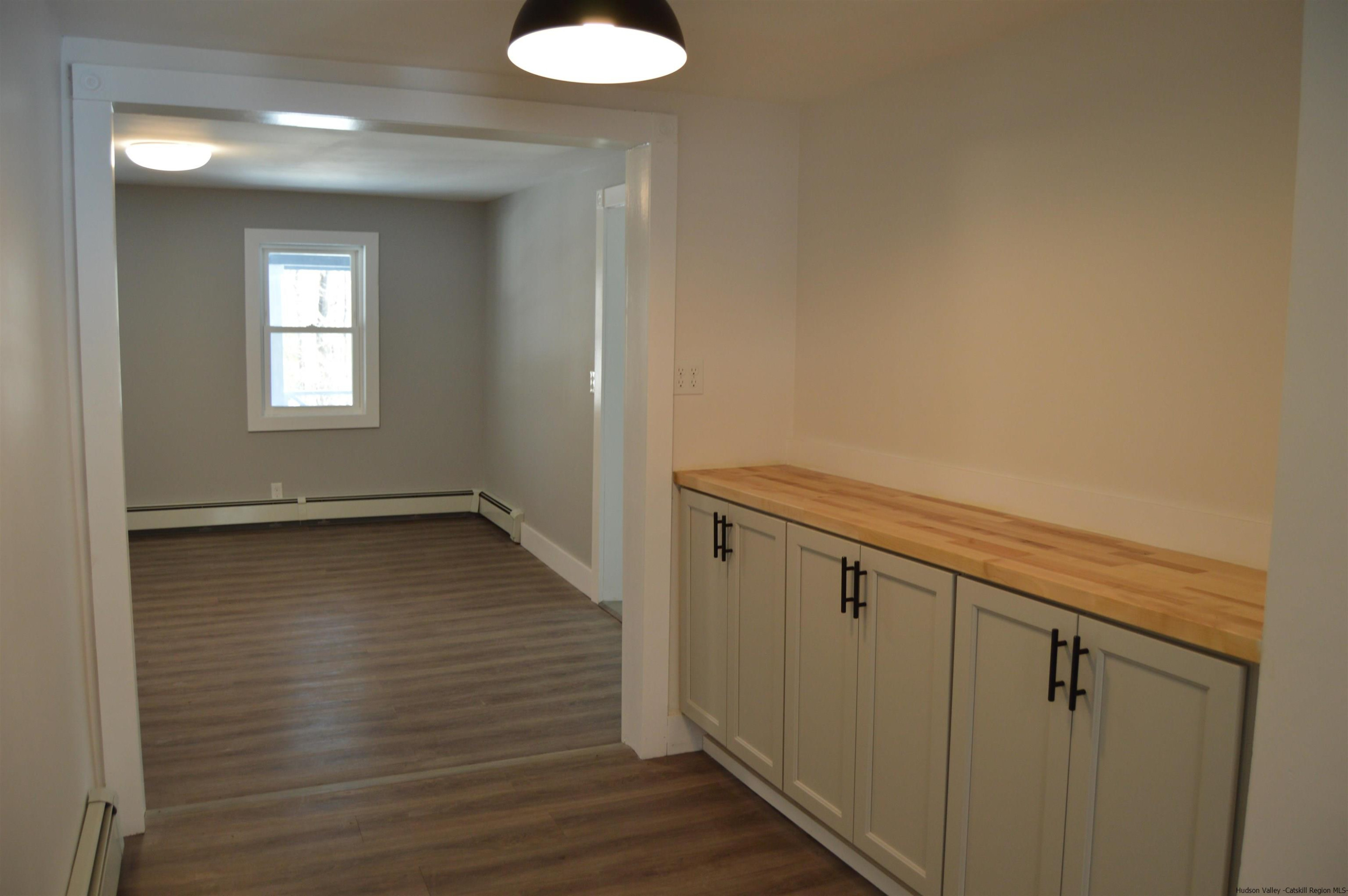 128 Cole Bank Road Saugerties, NY 12477 - Photo 7 of 26 a view of an empty room with wooden floor and a window