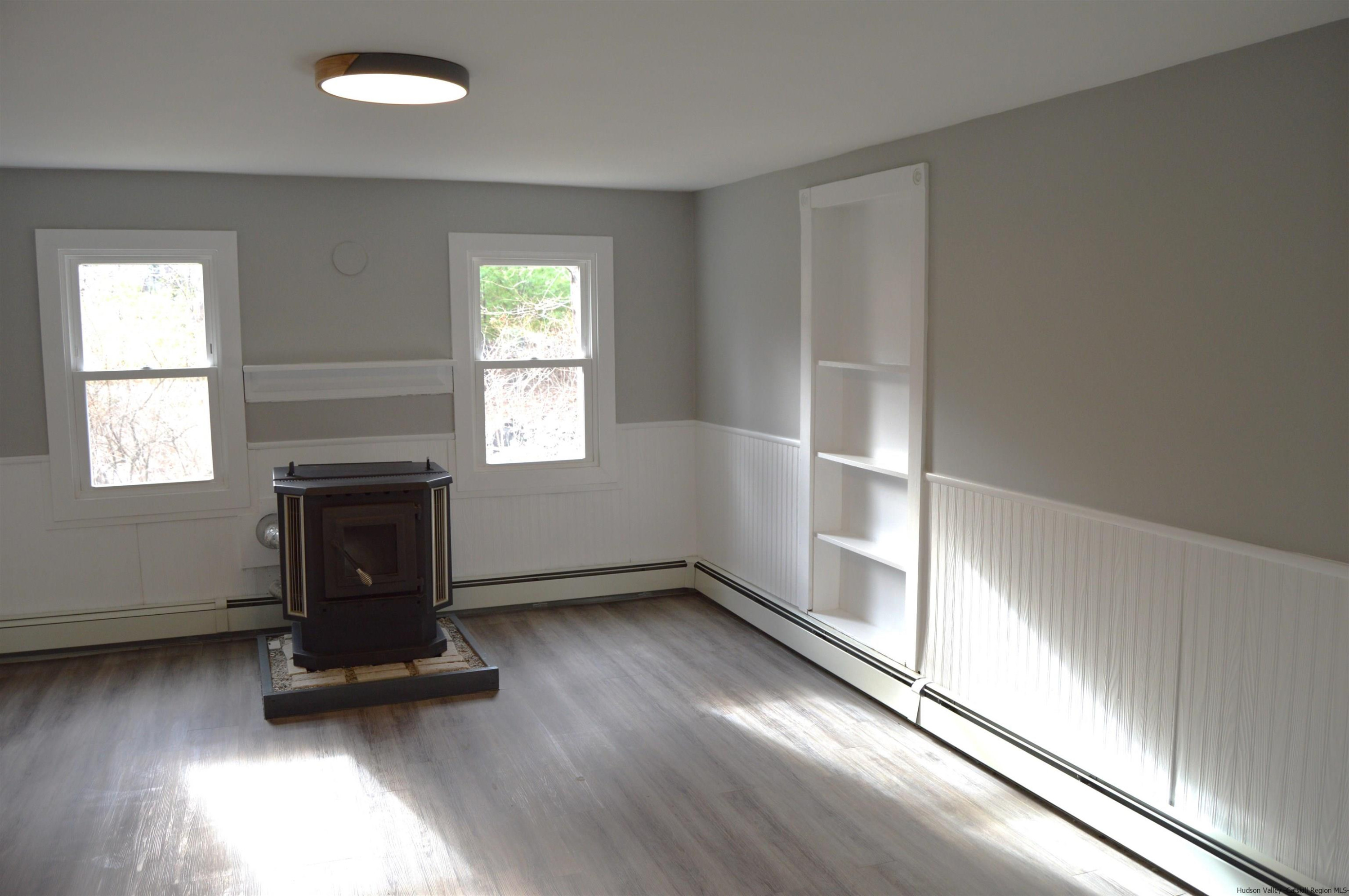 128 Cole Bank Road Saugerties, NY 12477 - Photo 8 of 26 an empty room with windows