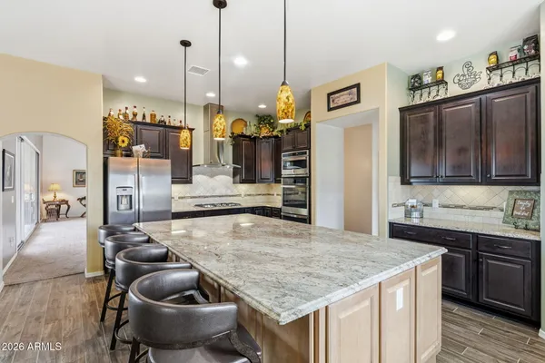a kitchen with sink and refrigerator