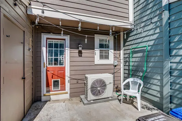 an outdoor view of a house with outdoor seating