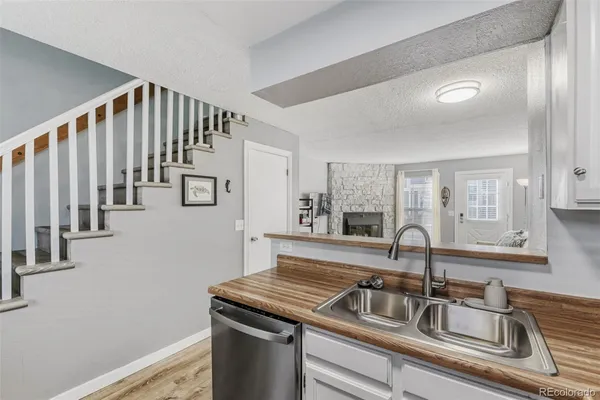 a kitchen with a sink and a window