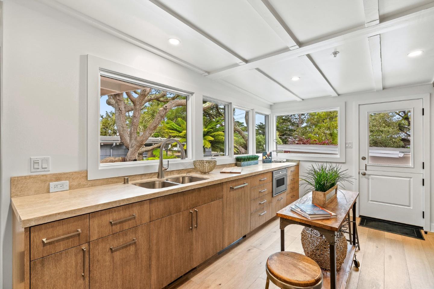 0 Santa Fe 4 Se Of Ocean Avenue Carmel, CA 93923 - Photo 14 of 34 a kitchen with a sink and wooden floor