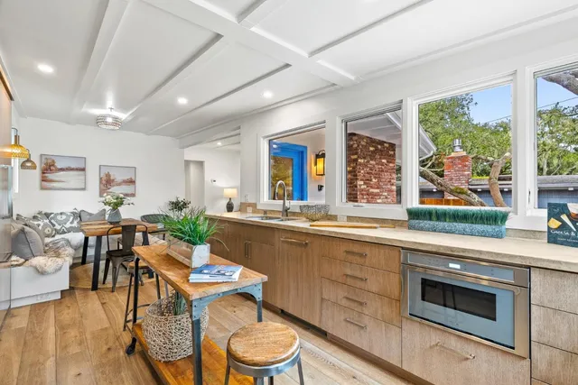 a bedroom with a bed and a potted plant