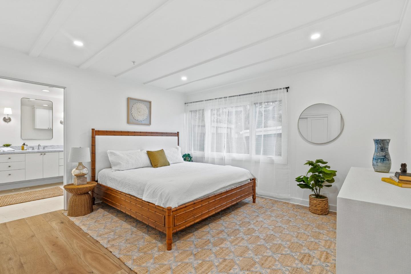 0 Santa Fe 4 Se Of Ocean Avenue Carmel, CA 93923 - Photo 19 of 34 a bed room with a bed and a potted plant