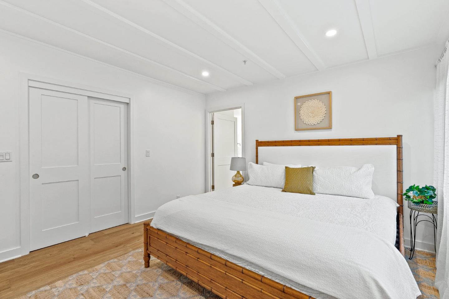 0 Santa Fe 4 Se Of Ocean Avenue Carmel, CA 93923 - Photo 20 of 34 a bedroom with a bed and a potted plant