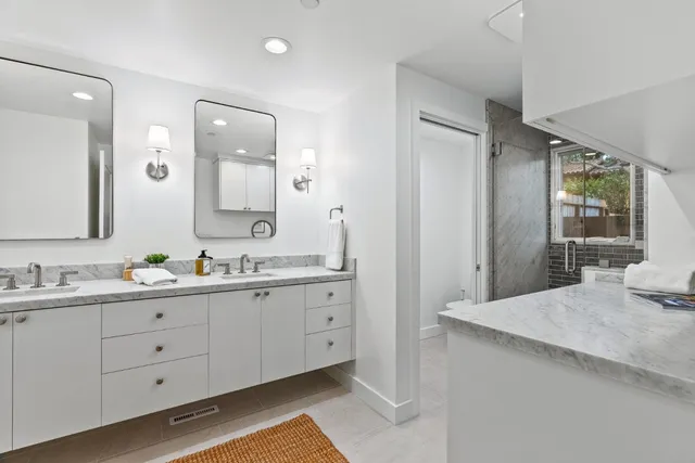 a utility room with cabinets washer and dryer