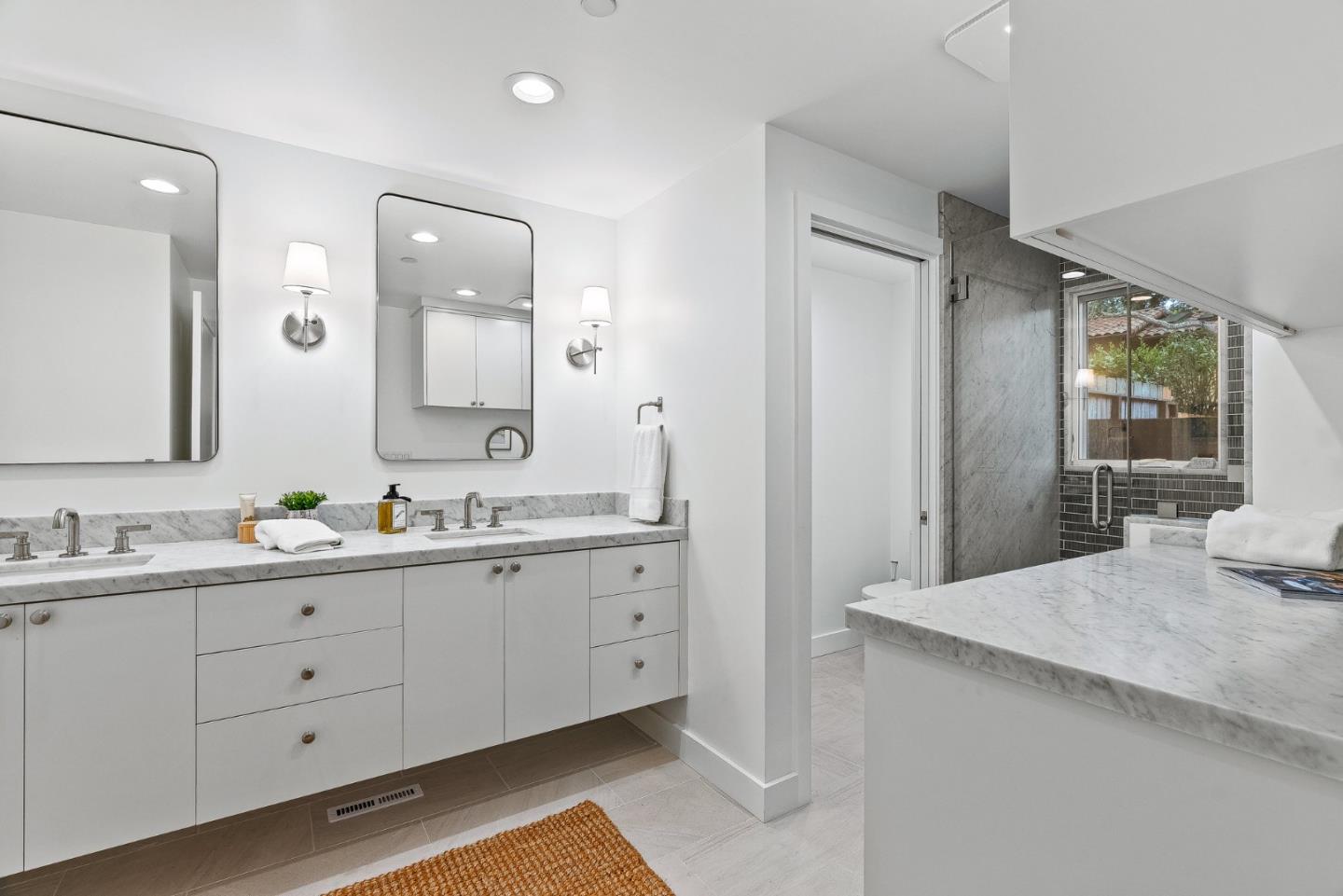 0 Santa Fe 4 Se Of Ocean Avenue Carmel, CA 93923 - Photo 22 of 34 a spacious bathroom with a granite countertop sink a mirror and a