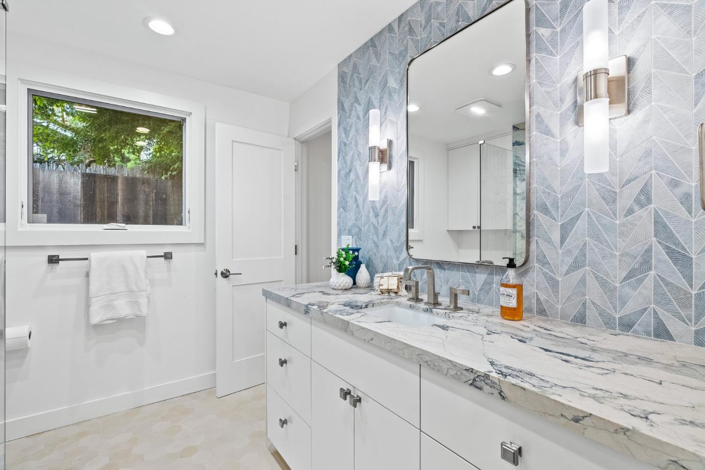 0 Santa Fe 4 Se Of Ocean Avenue Carmel, CA 93923 - Photo 28 of 34 a bathroom with a sink and a mirror