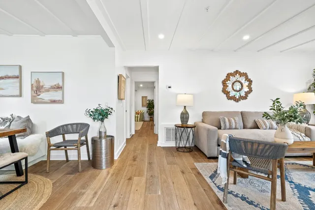 a living room with furniture and a table