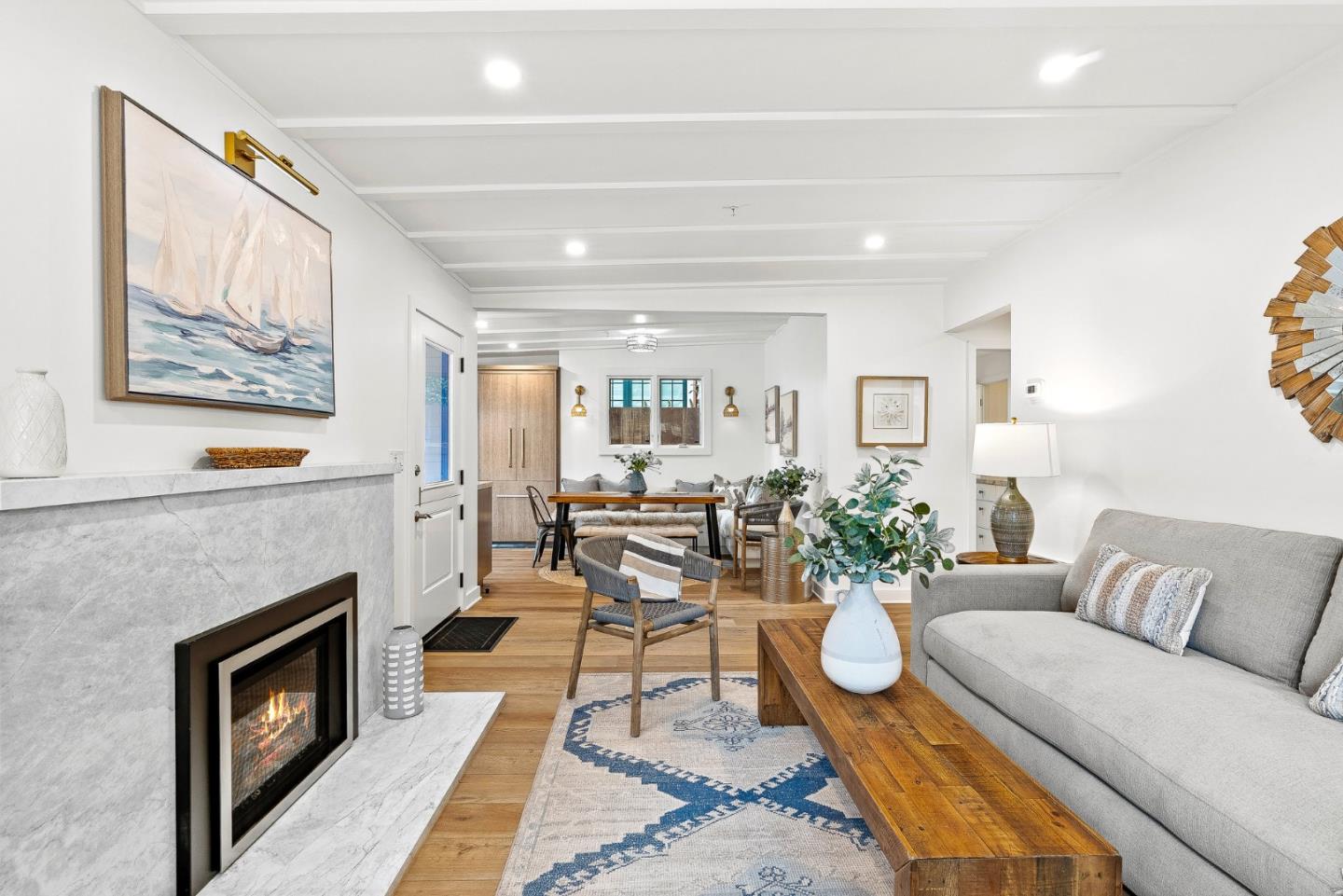 0 Santa Fe 4 Se Of Ocean Avenue Carmel, CA 93923 - Photo 9 of 34 a living room with furniture a fireplace and a painting