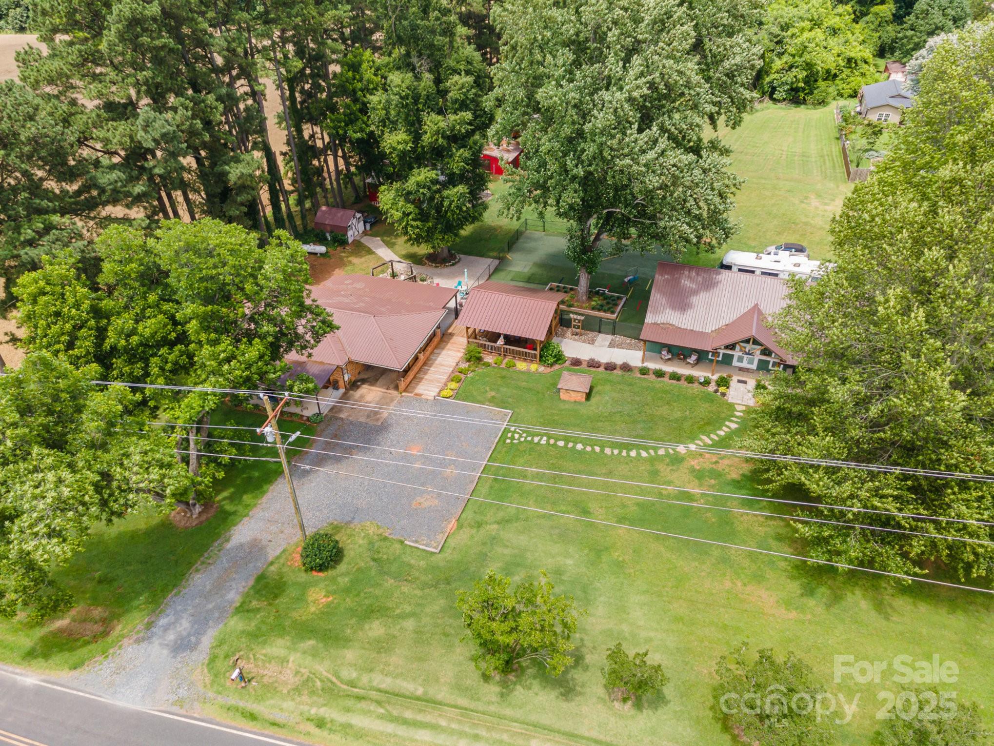an aerial view of house with yard swimming pool and outdoor seating