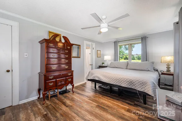 a bedroom with a large bed and a flat screen tv