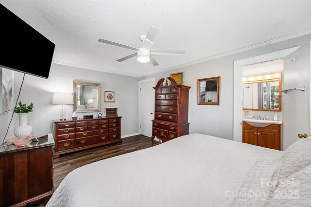 a bathroom with a sink a mirror and shower