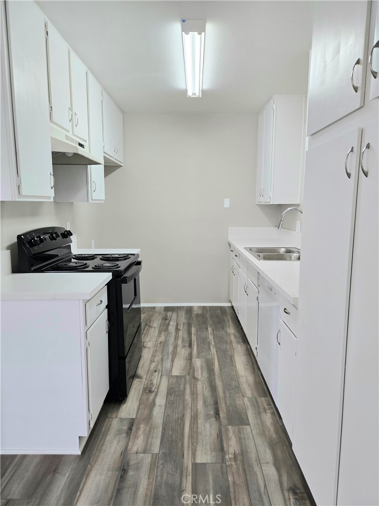 10979 Rincon Street Loma Linda, CA 92354 - Photo 7 of 13 a kitchen with a sink stove and cabinets