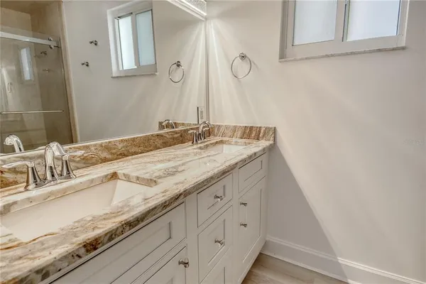 a bathroom with a shower and toilet