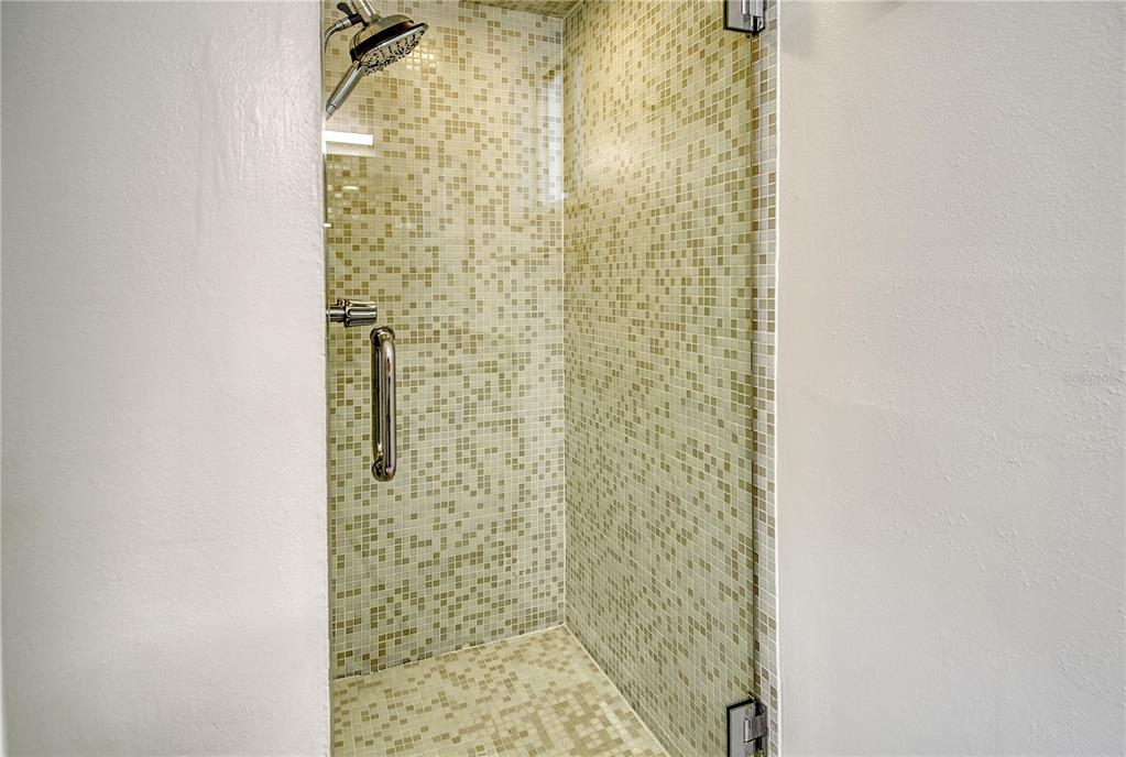 660 Golden Gate Point, Unit 32 Sarasota, FL 34236 - Photo 30 of 52 a bathroom with a shower