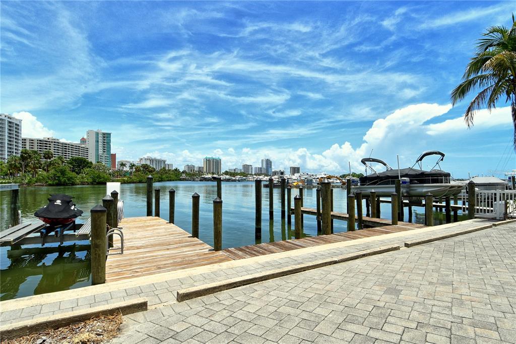 660 Golden Gate Point, Unit 32 Sarasota, FL 34236 - Photo 36 of 52 a view of a balcony with two chairs and a table