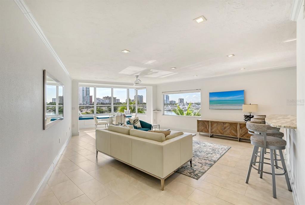 660 Golden Gate Point, Unit 32 Sarasota, FL 34236 - Photo 4 of 52 a living room with furniture and a couch