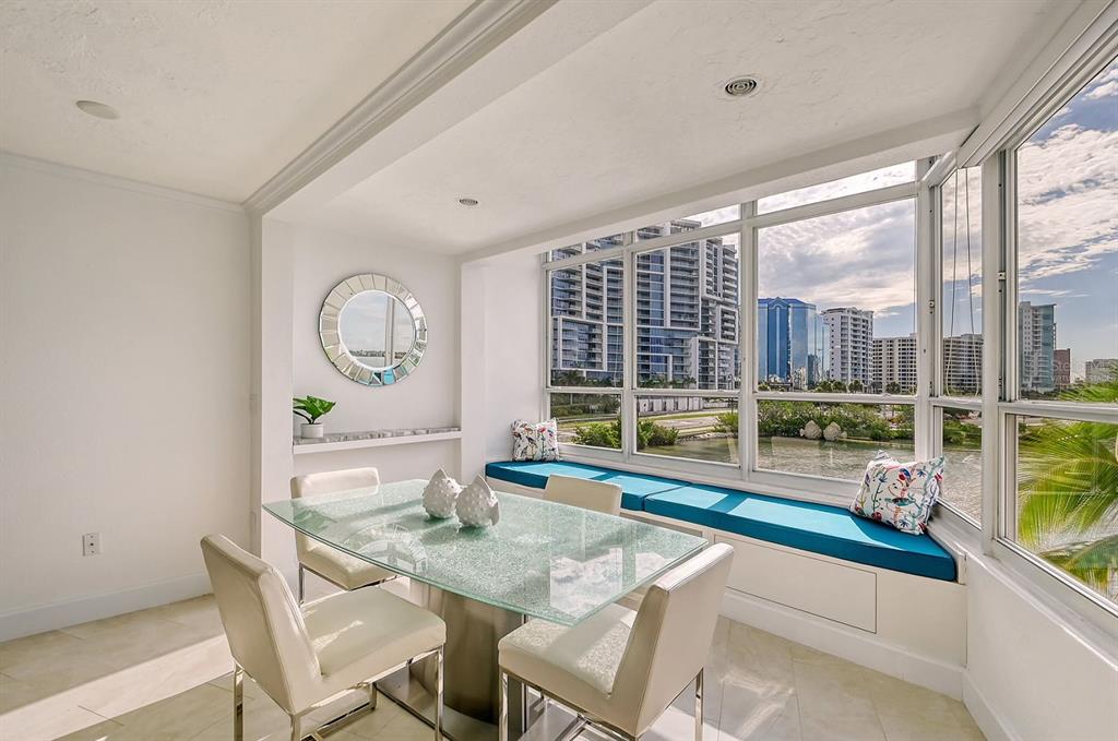 660 Golden Gate Point, Unit 32 Sarasota, FL 34236 - Photo 10 of 52 a dining room with furniture and a large window