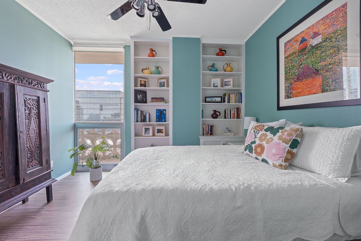 1801 Lavaca Street, Unit 12K Austin, TX 78701 - Photo 13 of 27 a bedroom with a bed and a painting on the wall