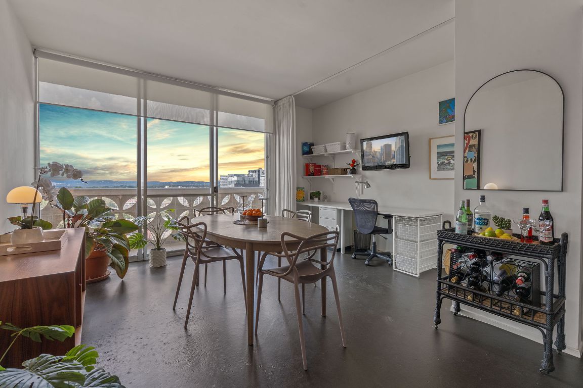 1801 Lavaca Street, Unit 12K Austin, TX 78701 - Photo 2 of 27 a dining room with furniture window and wooden floor