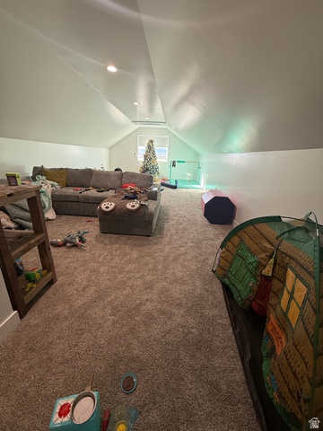 3550 North River Ln Road East Panguitch, UT 84759 - Photo 20 of 25 Spacious attic room featuring recessed lighting, a window providing natural light, sloped ceilings, and plush carpet flooring