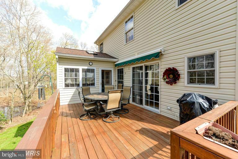 29 Range Road North East, MD 21901 - Photo 22 of 30 Rear deck, enclosed sunroom and retractable awning