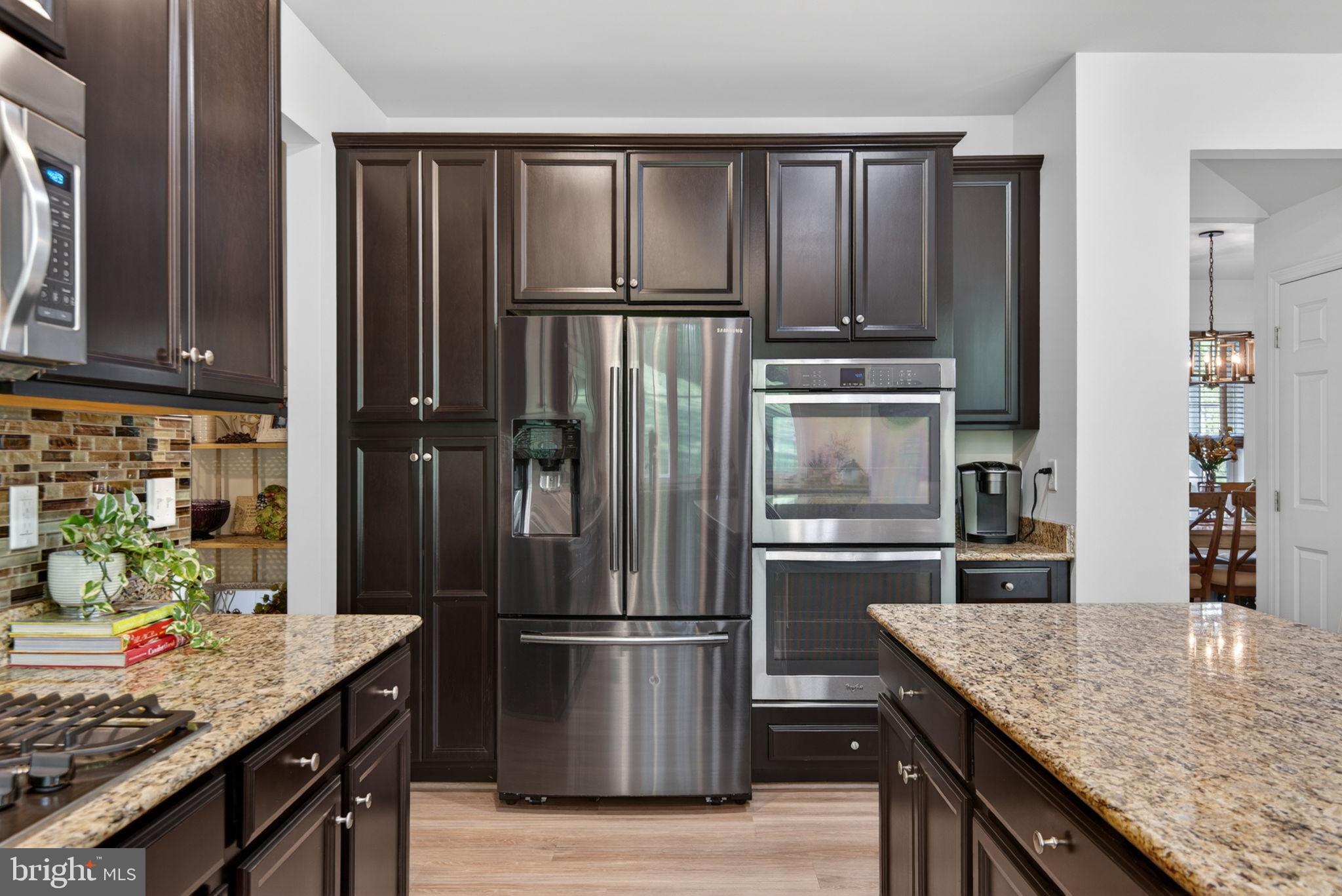 131 Freys Road Elizabethtown, PA 17022 - Photo 45 of 72 a kitchen with granite countertop stainless steel appliances and wooden cabinets