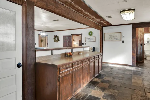 a kitchen with stainless steel appliances granite countertop a sink and stove