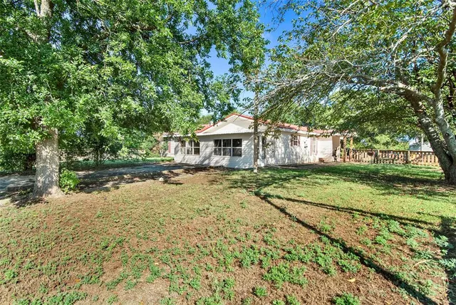 front view of house with a yard