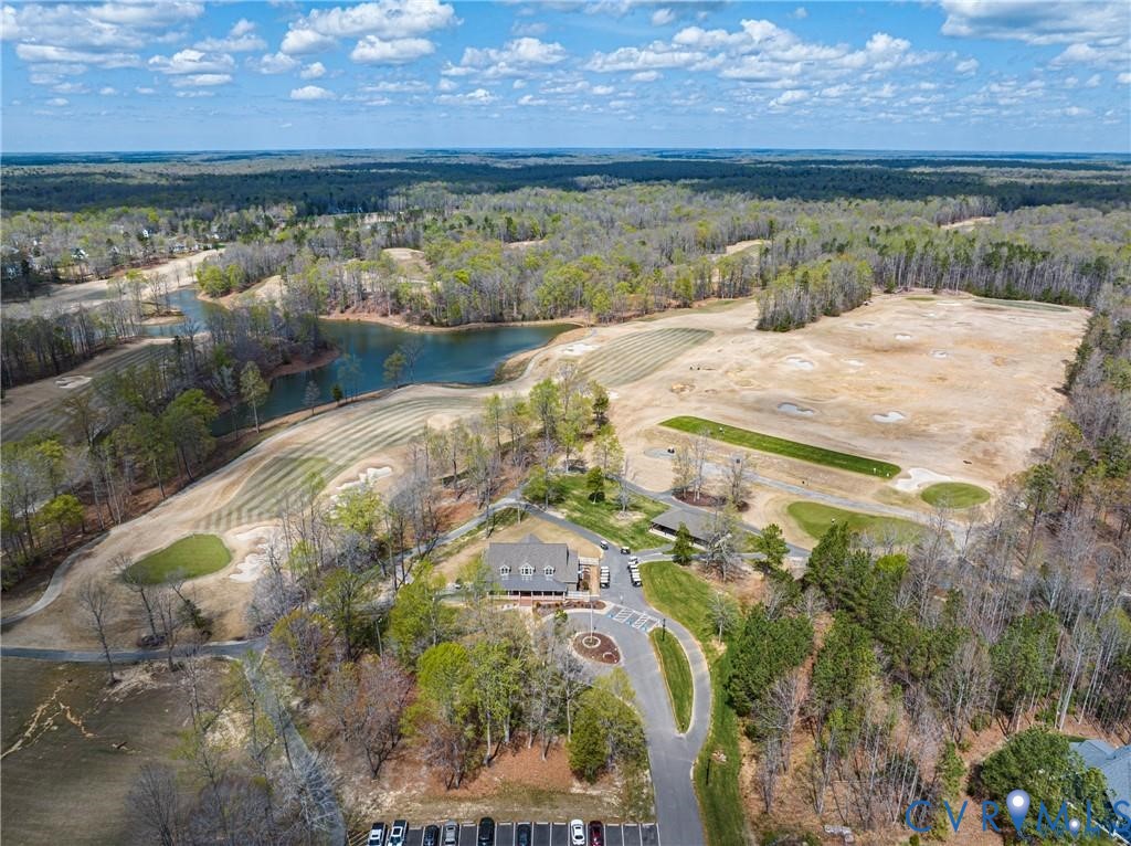 7195 Canopy Circle New Kent, VA 23124 - Photo 11 of 11 a view of a lake with a yard