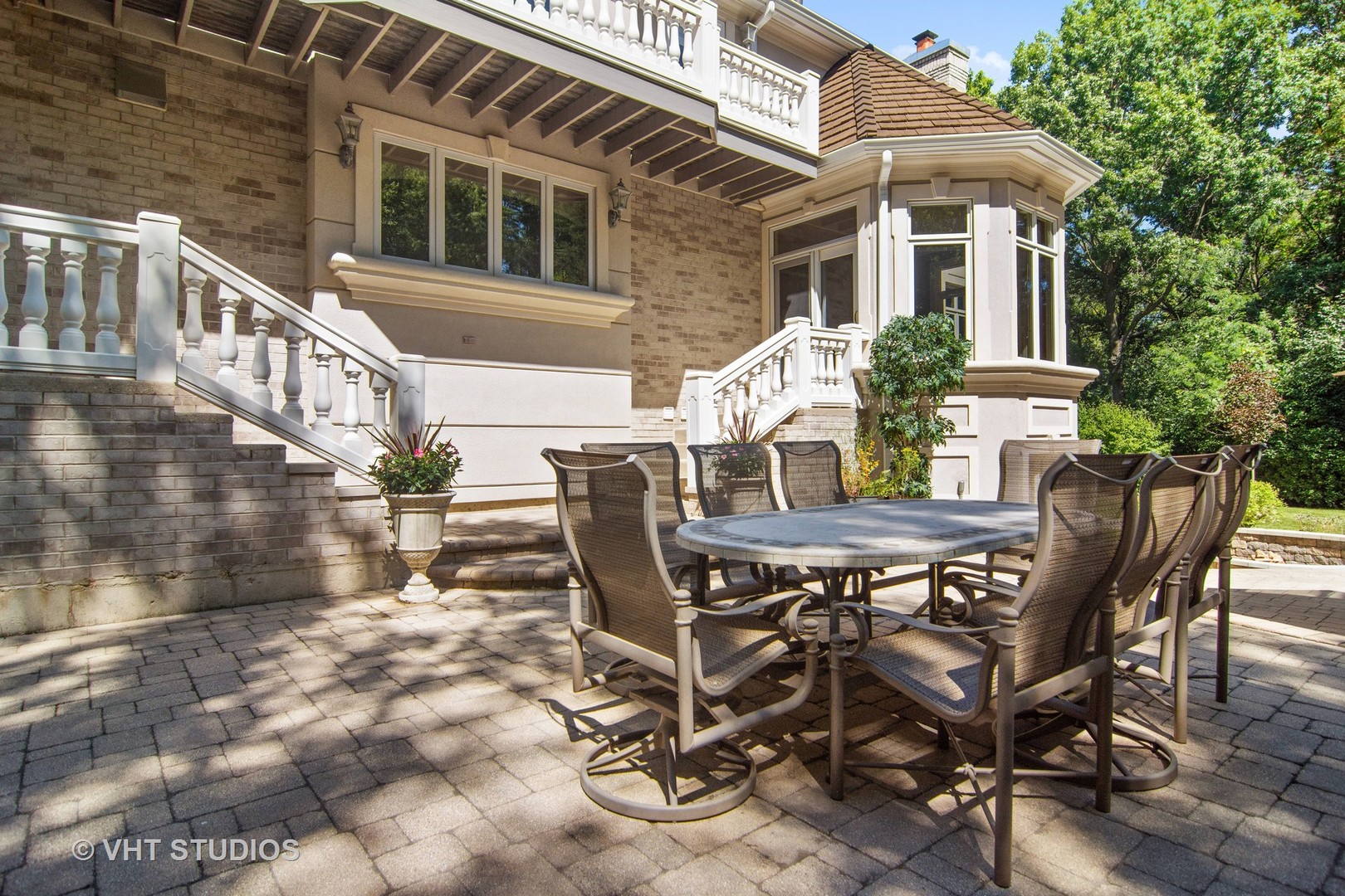 1860 Pheasant Run Long Grove, IL 60047 - Photo 54 of 76 a view of a patio with table and chairs and wooden fence