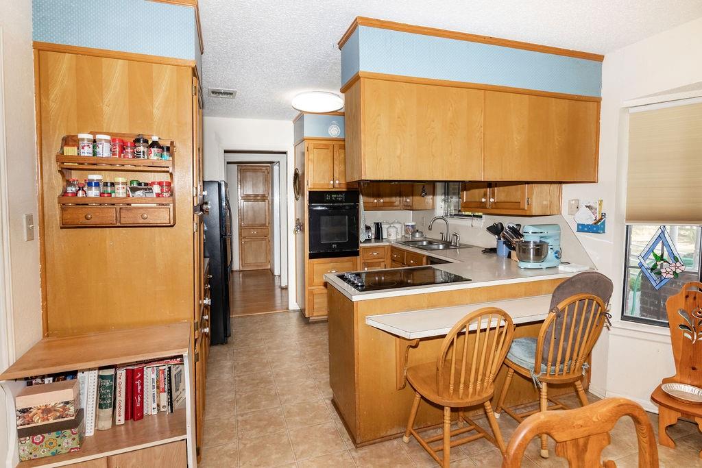 471 Hcr 3335 Road Hubbard, TX 76648 - Photo 13 of 40 a kitchen with stainless steel appliances a refrigerator a sink and a refrigerator