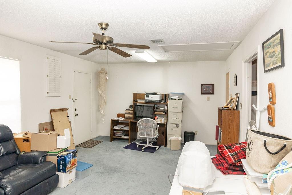 471 Hcr 3335 Road Hubbard, TX 76648 - Photo 17 of 40 a view of a workspace with furniture and a window