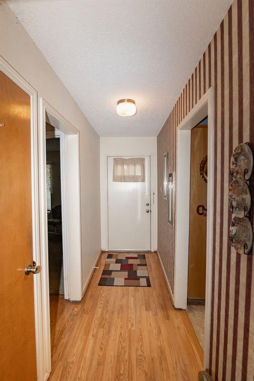 471 Hcr 3335 Road Hubbard, TX 76648 - Photo 25 of 40 a view of a hallway with wooden floor and staircase