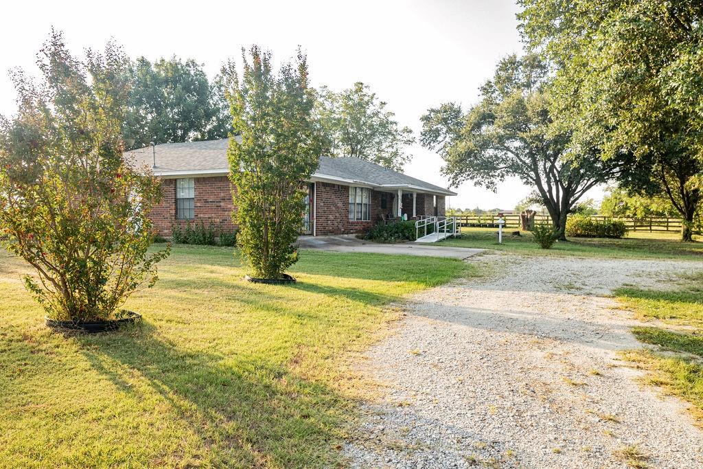 471 Hcr 3335 Road Hubbard, TX 76648 - Photo 32 of 40 a view of a yard with plants and trees