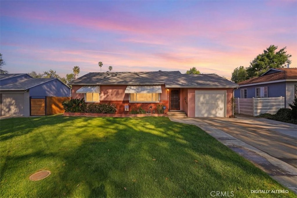 7869 Sycamore Avenue Riverside, CA 92504 - Photo 2 of 36 a front view of a house with a garden