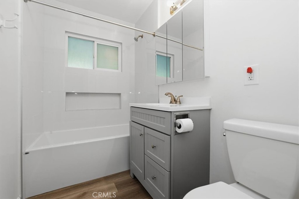 7869 Sycamore Avenue Riverside, CA 92504 - Photo 24 of 36 a bathroom with a sink toilet vanity and tub