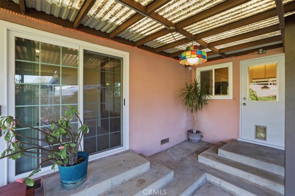 7869 Sycamore Avenue Riverside, CA 92504 - Photo 25 of 36 a front view of a house with a potted plant