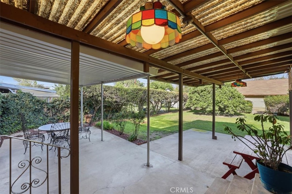 7869 Sycamore Avenue Riverside, CA 92504 - Photo 28 of 36 a view of a porch with furniture and garden