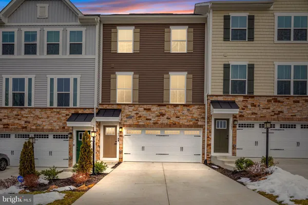 a front view of a building with a garage