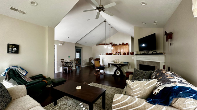929 West 1920 South, Unit A Syracuse, UT 84075 - Photo 8 of 26 Living room featuring a tile fireplace, wood-type flooring, vaulted ceiling, and ceiling fan