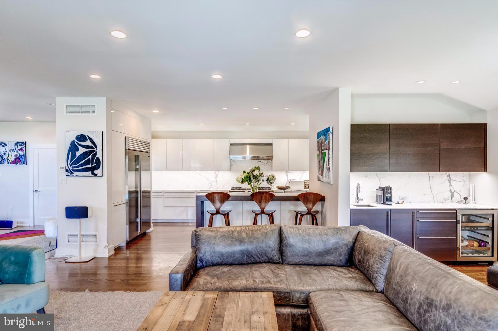 609 St Andrews Road Philadelphia, PA 19118 - Photo 11 of 31 a living room with furniture kitchen view and a wooden floor