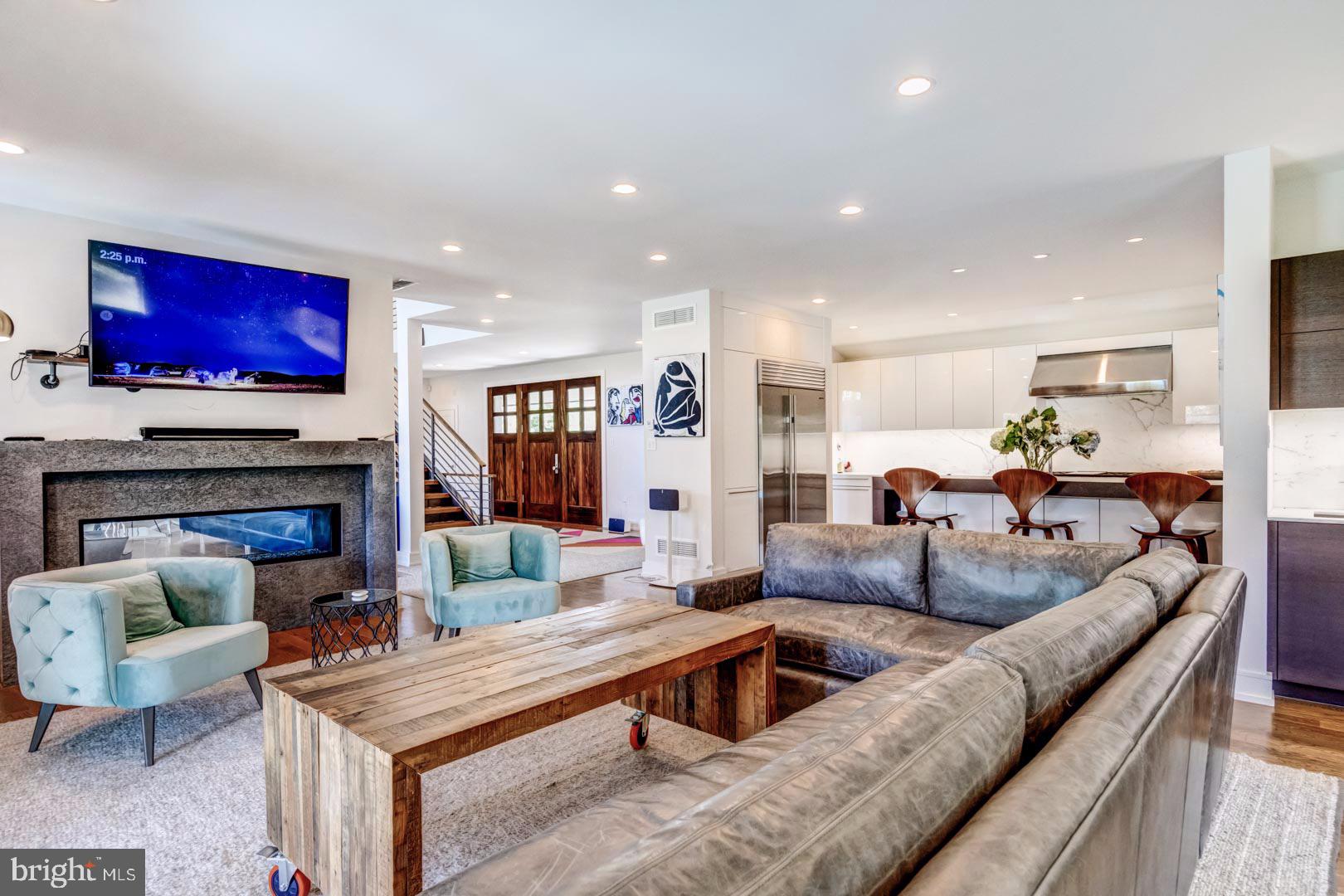609 St Andrews Road Philadelphia, PA 19118 - Photo 13 of 31 a living room with furniture and a fireplace