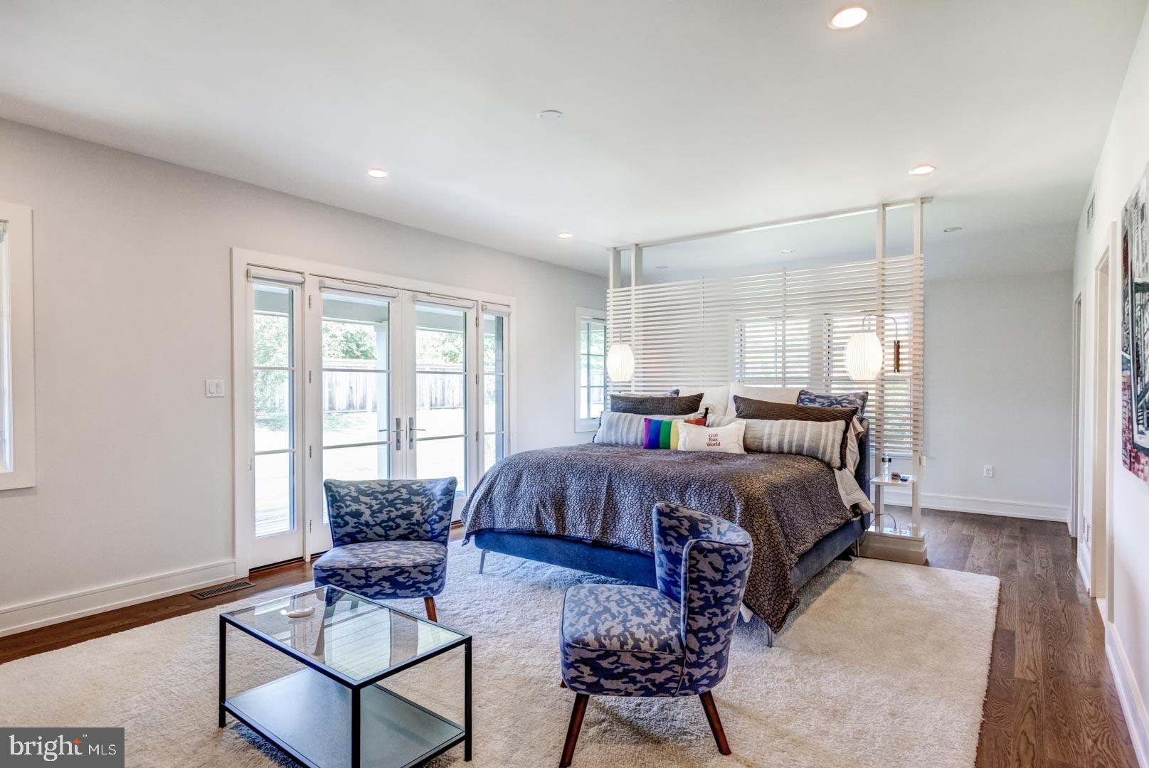 609 St Andrews Road Philadelphia, PA 19118 - Photo 16 of 31 a spacious bedroom with a bed and a couch