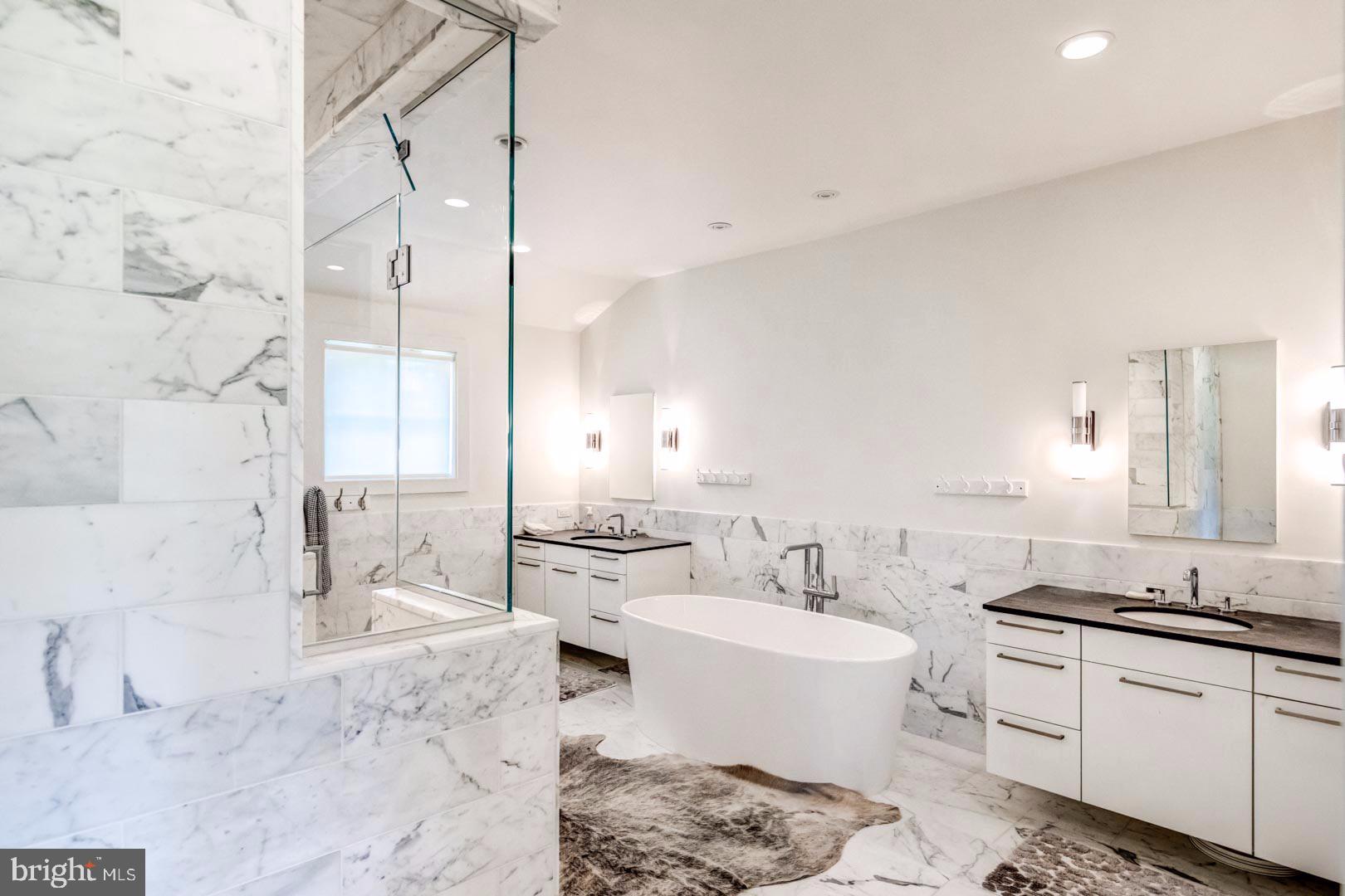 609 St Andrews Road Philadelphia, PA 19118 - Photo 18 of 31 a bathroom with a double vanity sink toilet mirror and bathtub