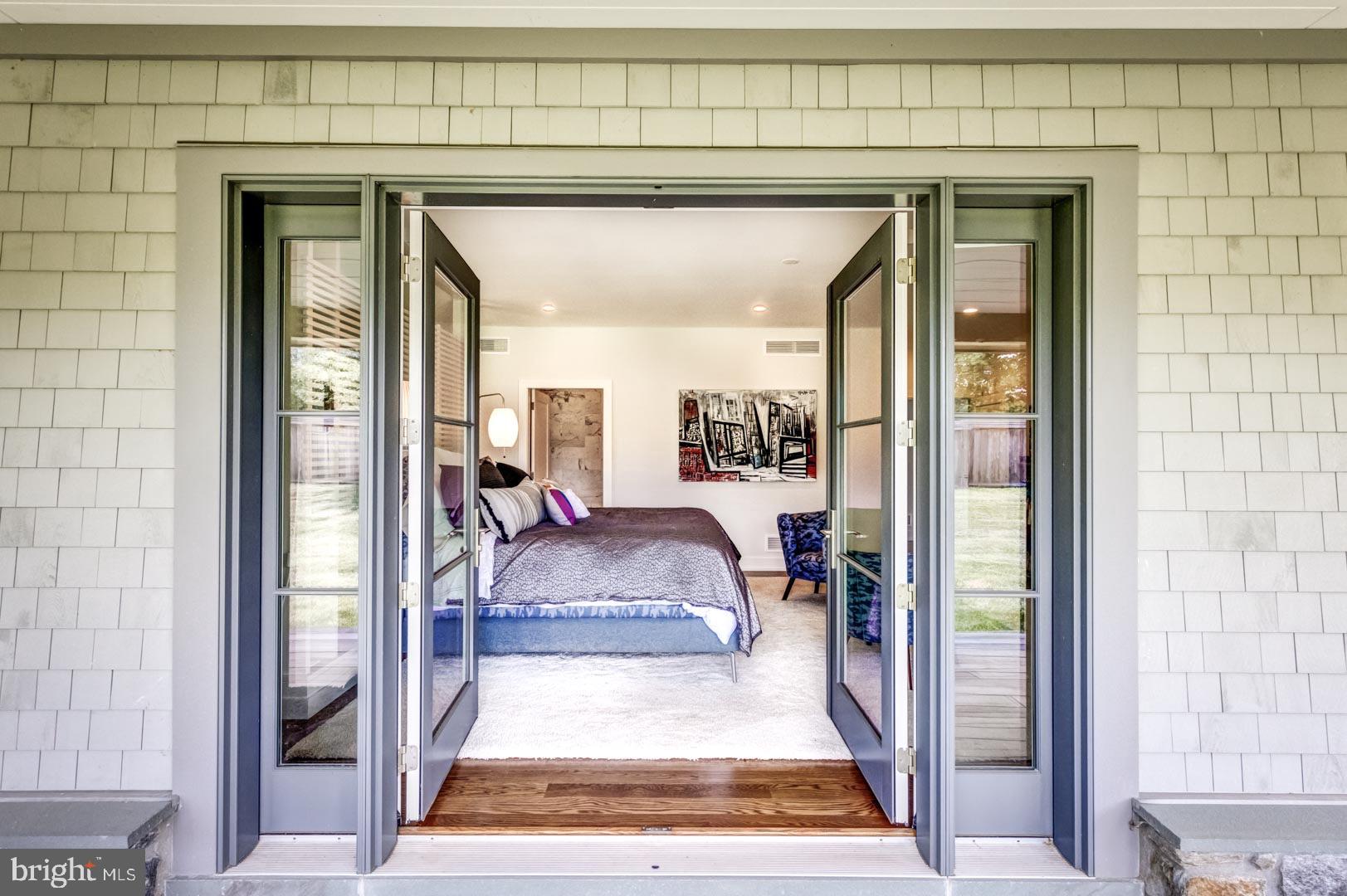 609 St Andrews Road Philadelphia, PA 19118 - Photo 19 of 31 a living room with a couch and a table