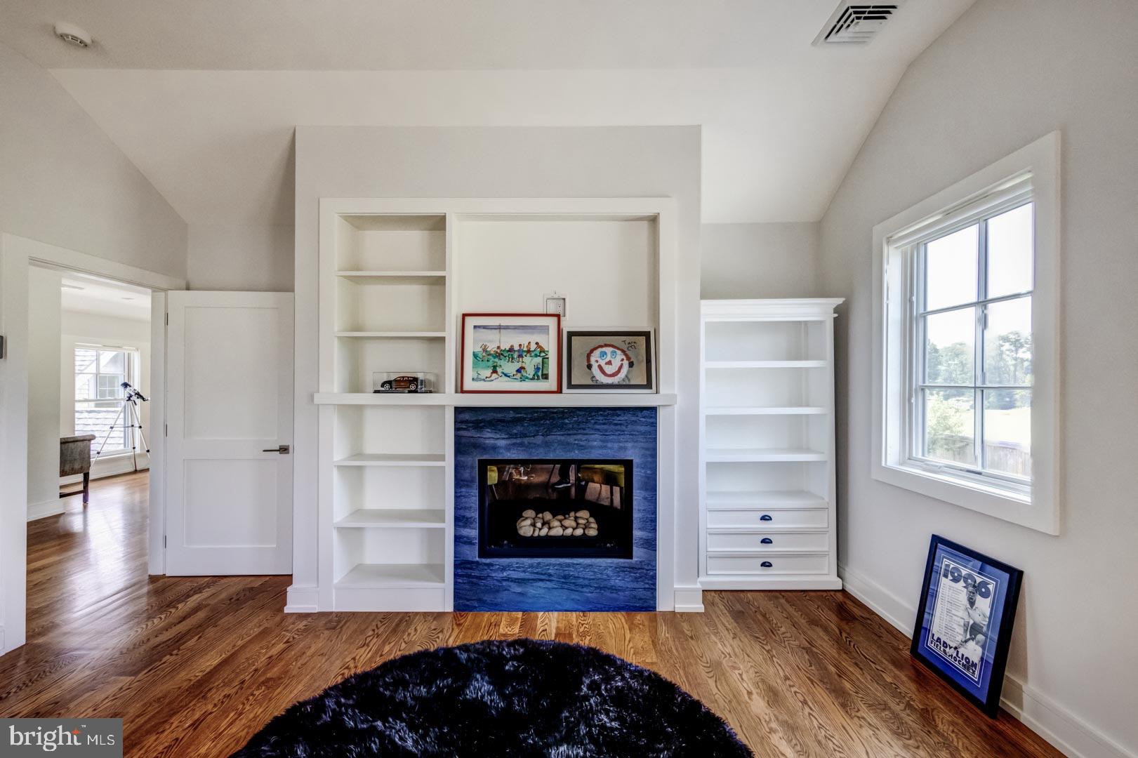 609 St Andrews Road Philadelphia, PA 19118 - Photo 22 of 31 a living room with furniture and a fireplace