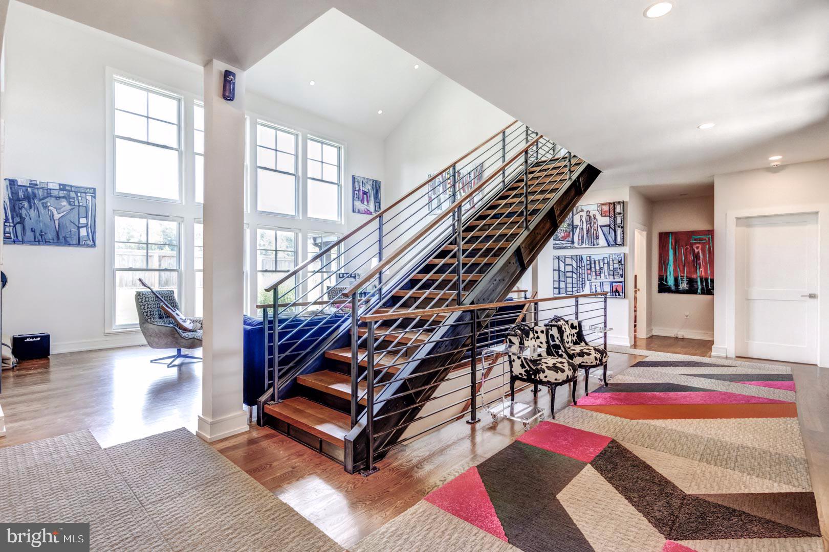 609 St Andrews Road Philadelphia, PA 19118 - Photo 7 of 31 a room with lots of white furniture and a rug