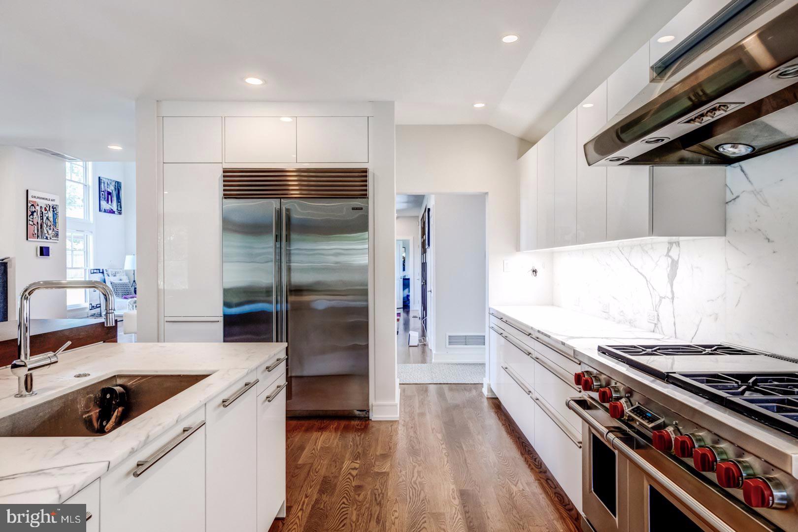 609 St Andrews Road Philadelphia, PA 19118 - Photo 9 of 31 a kitchen with stainless steel appliances a stove a sink and a refrigerator